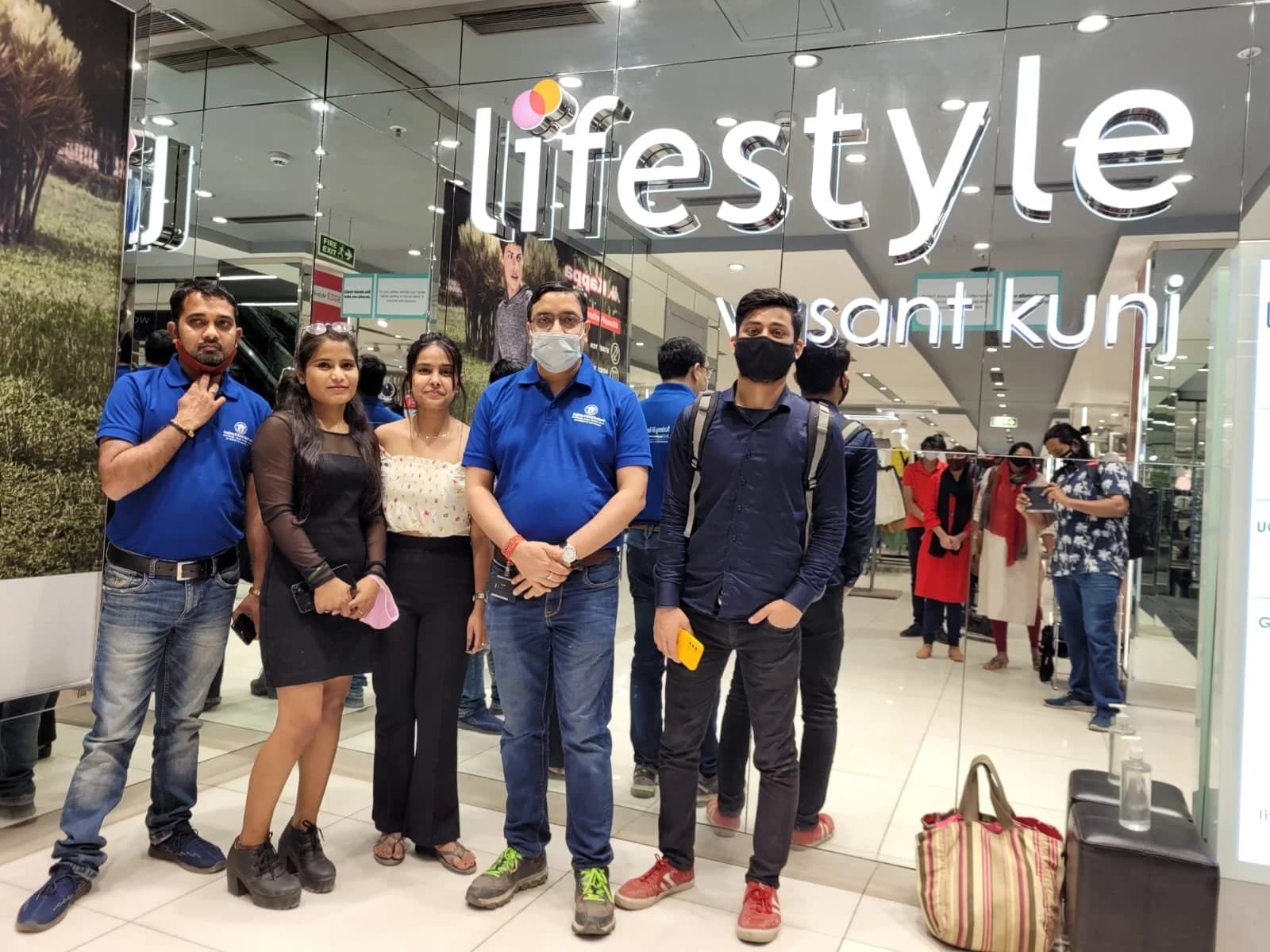 A group of Academy of Retail Excellence students photographed together. Sign visible in the photograph: Lifestyle, Vasant Kunj.
