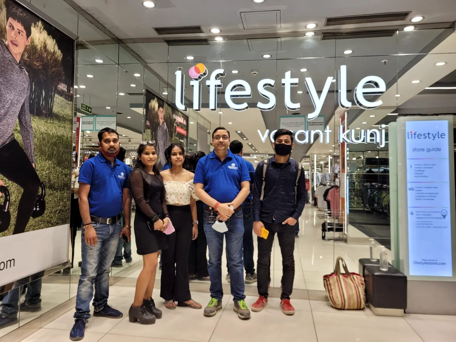 A group of Academy of Retail Excellence students photographed together. Sign visible in the photograph: Lifestyle, Vasant Kunj.